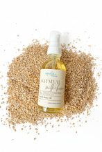 Load image into Gallery viewer, Oatmeal milk and honey oil bottle surrounded by oatmeal 